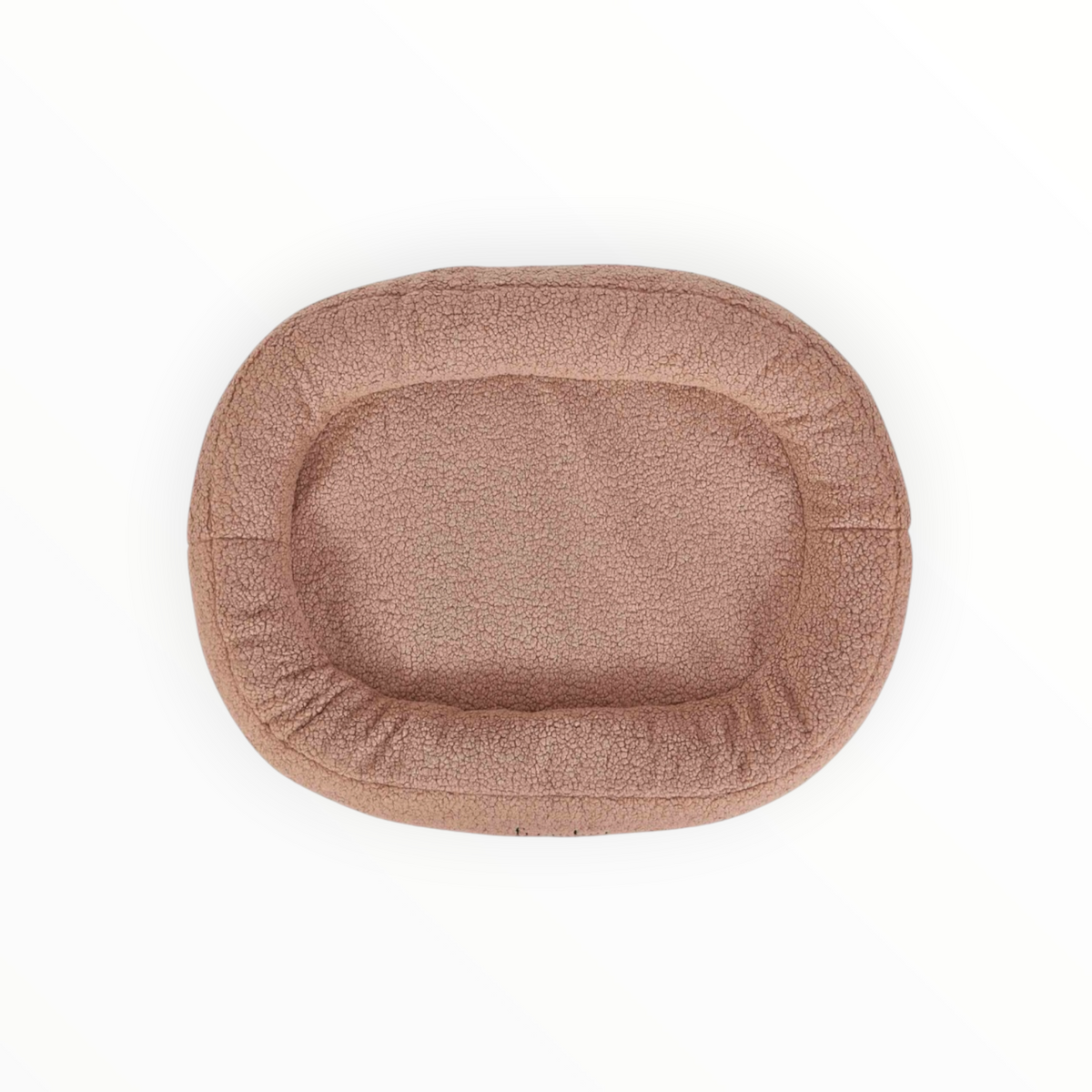 Cama oval de borreguito con borde acolchado e interior impermeable